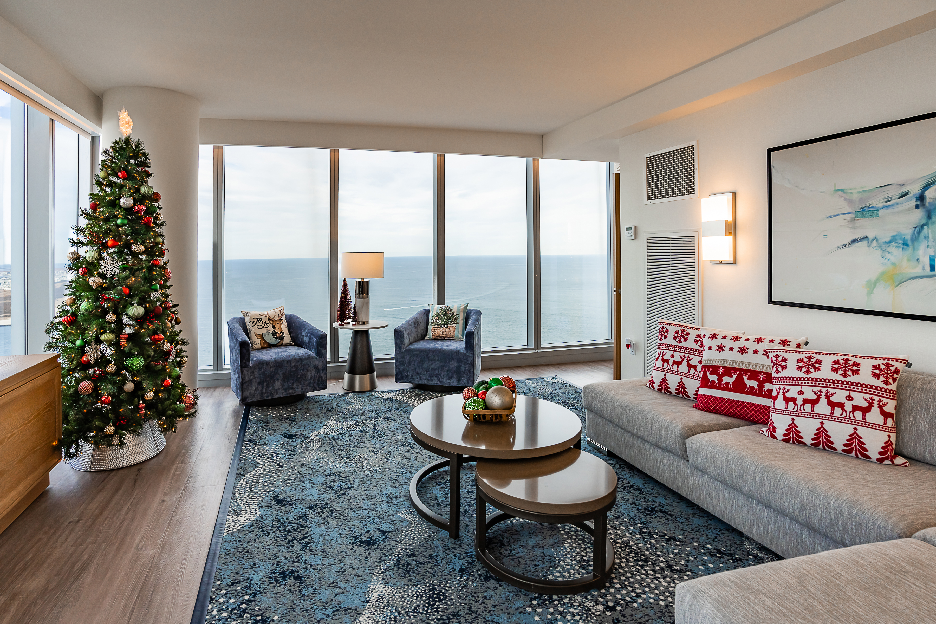 Ocean Casino Resort suite decorated for the holidays with a Christmas tree and Atlantic Ocean views.