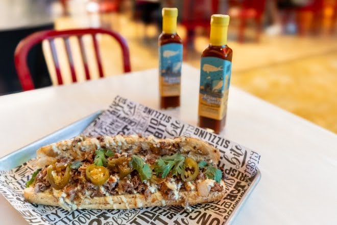 Limited-edition cheesesteak collaboration with local Hank Sauce hot sauce, created for Ocean Casino Resort’s 7th birthday celebration in Atlantic City.