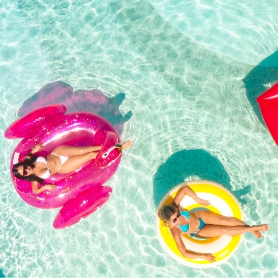 Women floating in pool