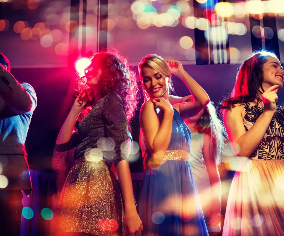 group of friends dancing in the club
