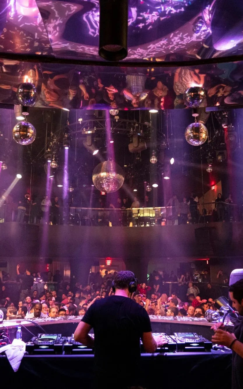 DJ performing for a packed crowd at HQ2 Nightclub inside Ocean Casino Resort.