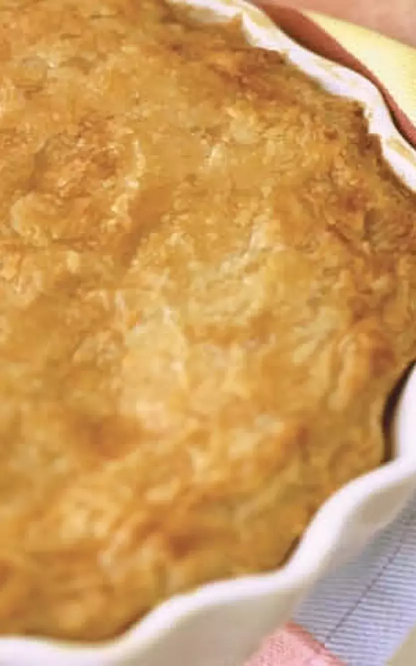 Little girl holding a fresh-baked pie