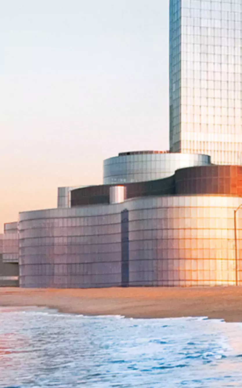 Exterior of Ocean Casino Resort next to the beach and water