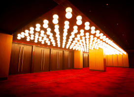 Entrance to Ovation Hall at Ocean Casino Resort in Atlantic City, featuring red carpet flooring and marquee-style ceiling lights.